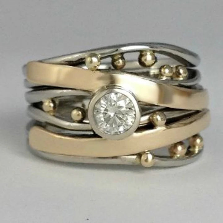 Ring met zirkonia in goud en zilver